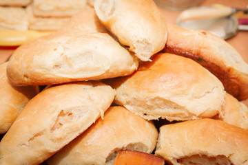 Ruddy delicious freshly baked cakes laid out in a pile on the plate