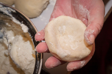 Preparation of round cheesecakes with cottage cheese and raisins