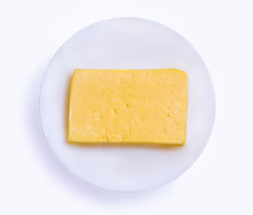 Cheese in a plate on a white background