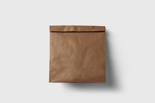 Paper Bag Package Of Coffee, Salt, Sugar, Pepper, Spices Or Flour, Filled, Folded, Close, White. Ready For Your Design. Snack Product Packing isolated on soft gray background.High resolution photo.