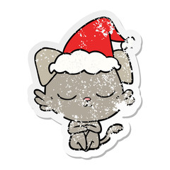 cute distressed sticker cartoon of a dog wearing santa hat