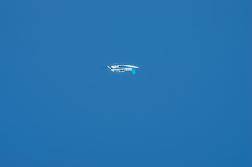 Aircraft Yakovlev Yak-18T performs aerobatics.