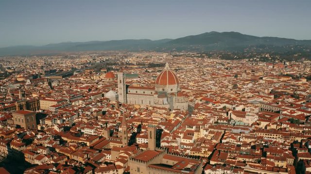 Aerial revealing shot of the city of Florence involving the Cathedral or Cattedrale di Santa Maria del Fiore, Italy