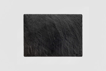 Black Rectangular stone plate with white background.High resolution photo.