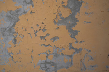 Yellow wall fragment with scratches and cracks 