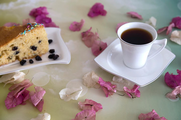A cup of coffee,service cake in the plate and tea for concept.