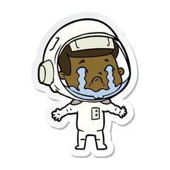 sticker of a cartoon crying astronaut
