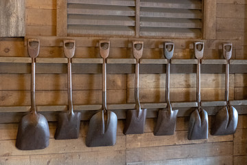 old shovel lean on wooden wall