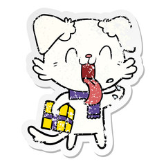 distressed sticker of a cartoon panting dog with present
