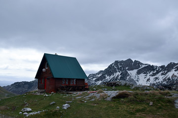 Fototapeta na wymiar Alone mountain hut in Durmitor National Park. Near Zabljak, Montenegro.