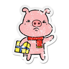 distressed sticker of a cartoon angry pig with christmas present