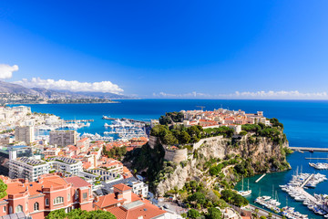 Naklejka na ściany i meble Cityscape and harbor of Monte Carlo. Aerial view of Monaco on a Sunny day, Monte Carlo, Principality of Monaco