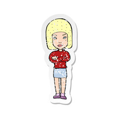 retro distressed sticker of a cartoon woman with crossed arms