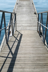 The empty concrete pier with steps with iron railing at the calm - 252316947