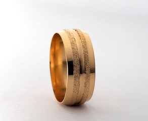 golden wedding rings on isolated white background 