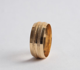 golden wedding rings on isolated white background 