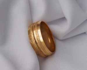 golden wedding rings on isolated white background 