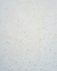 White background with specs of rust