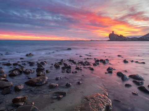 Beautiful view of bright cloudy evening sky over majestic sea and rocky shore in spectacular nature