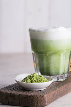 Preparing matcha latte beverage
