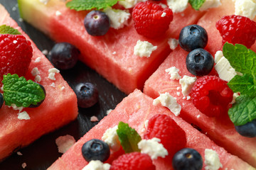 Juicy watermelon pizza with blueberries, raspberry feta cheese, mint. party food