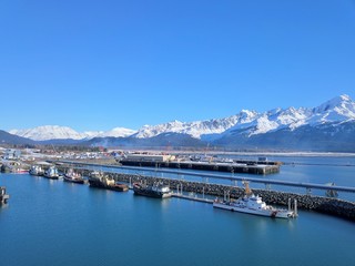 Coast Guard ship, tugboats, and commercial fishing boats in Alaska 