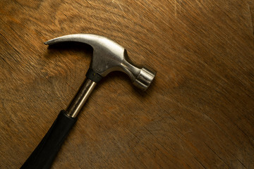  hammer on wood background