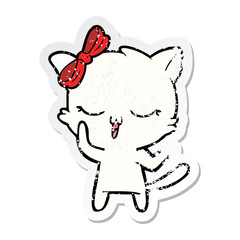 distressed sticker of a cartoon cat with bow on head