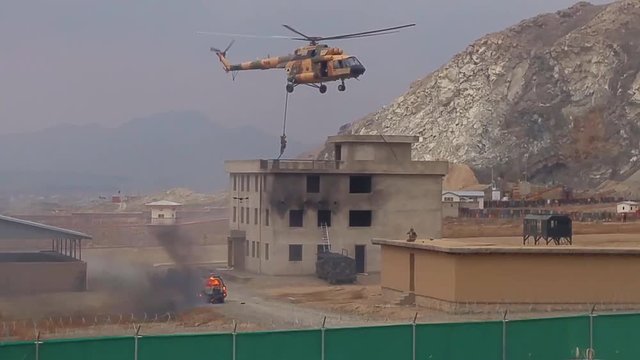 Crisis Response Unit 222 and 777th Special Mission Wing conduct fast rope training marine helicopter training on a simulated Arab village in the Middle East.