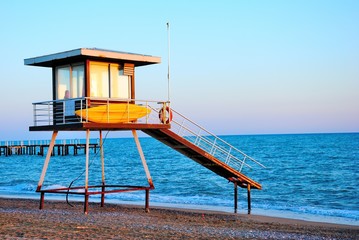 Safeguard tower on the Mediterranean beach on sunset in Turkey