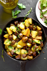 Fried potatoes with mushroom and sausage