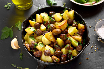 Fried potatoes with mushroom and sausage