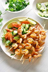 Prawns skewers with sauce