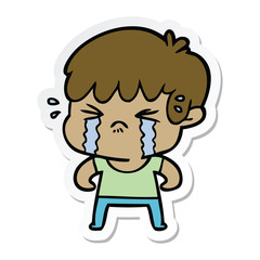 sticker of a cartoon boy crying