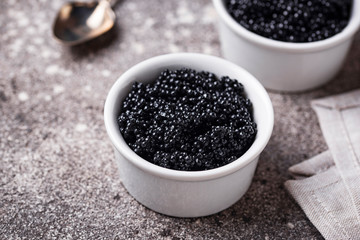 Fototapeta na wymiar Sturgeon black caviar in bowls