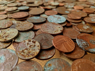 A pile of tarnished and partially corroded British copper coins - one and two pence pieces - and a lot of verdigris