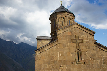Fototapeta premium Gergeti church near mountain Kazbegi, Stepantsminda, Georgia 