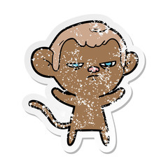 distressed sticker of a cartoon annoyed monkey