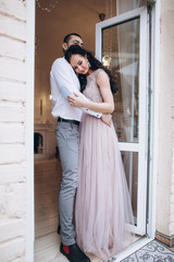 Tender beautiful romantic happy wedding couple hugging each other and holding hands. Bride and groom together in love. Happiness, family, couple concept