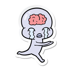 sticker of a cartoon big brain alien crying