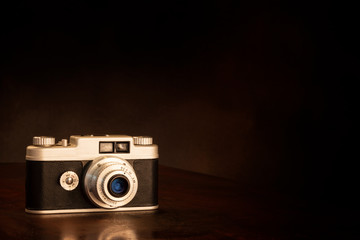 Old 1950s 35mm Camera On Brown Background With Copy Space