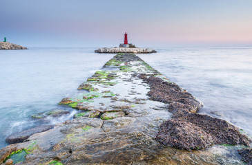 Rough path to islet with lighthouse