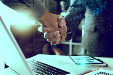 Businessmen shaking hands and teamwork concept