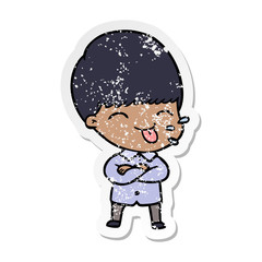 distressed sticker of a cartoon boy sticking out tongue
