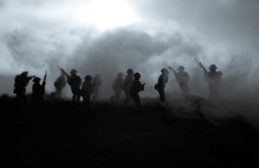 War Concept. Military silhouettes fighting scene on war fog sky background, World War Soldiers...