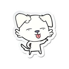 sticker of a cartoon dog sticking out tongue