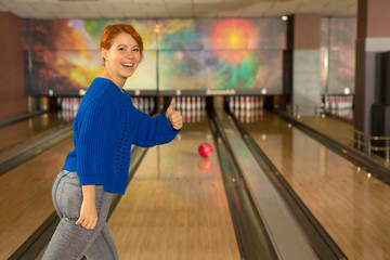 Woman playing bowling alone at the club