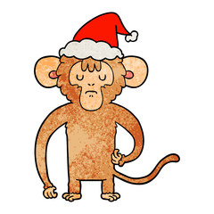 textured cartoon of a monkey scratching wearing santa hat