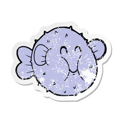 distressed sticker of a cartoon puffer fish