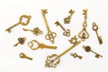 Decorative keys of different sizes, stylized antique on a white background. Form the centerpiece.